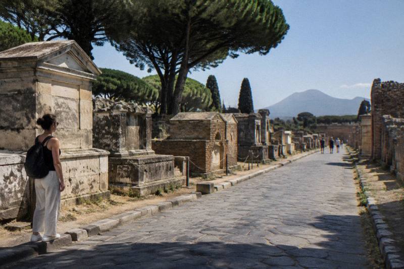 A row of weathered tombs on the road beyond Pompeii's gate