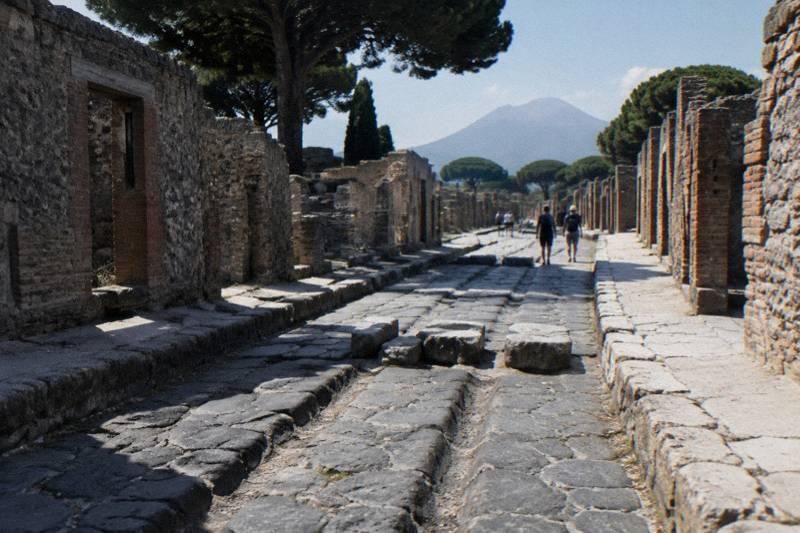 A Pompeii street with cart ruts in the paving and raised stepping stones