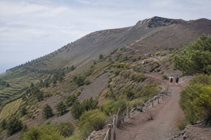 Hikers on the cinder trail up Mount Vesuvius