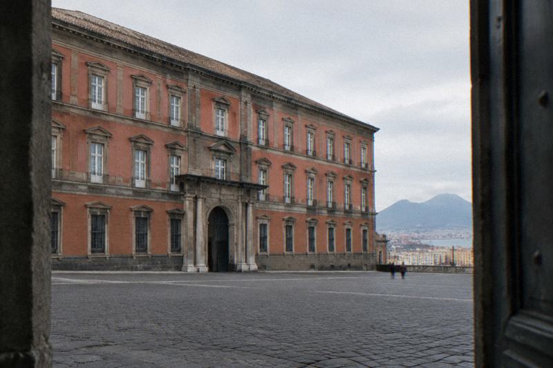 The grand pale-stone museum building in Naples
