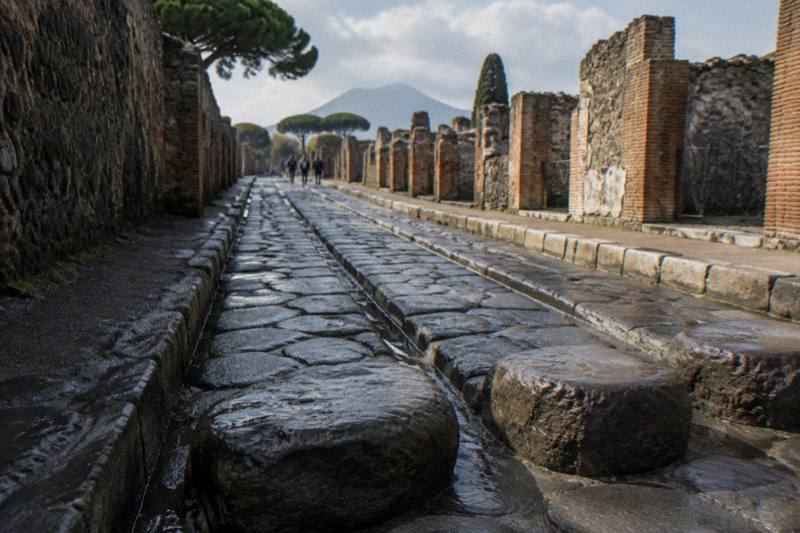 Stepping stones across a rutted ancient street in Pompeii