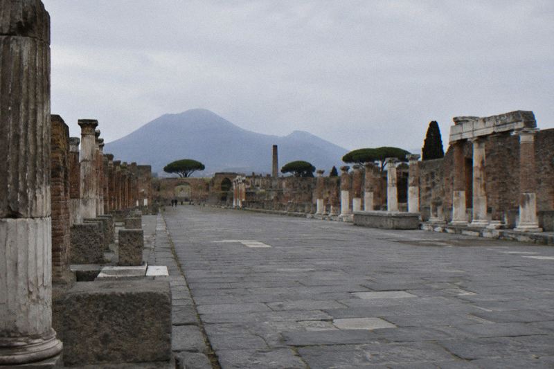 The paved forum of Pompeii with Vesuvius behind
