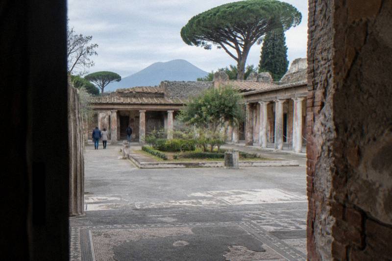 The wide entrance and columned court of a large Roman house at Pompeii