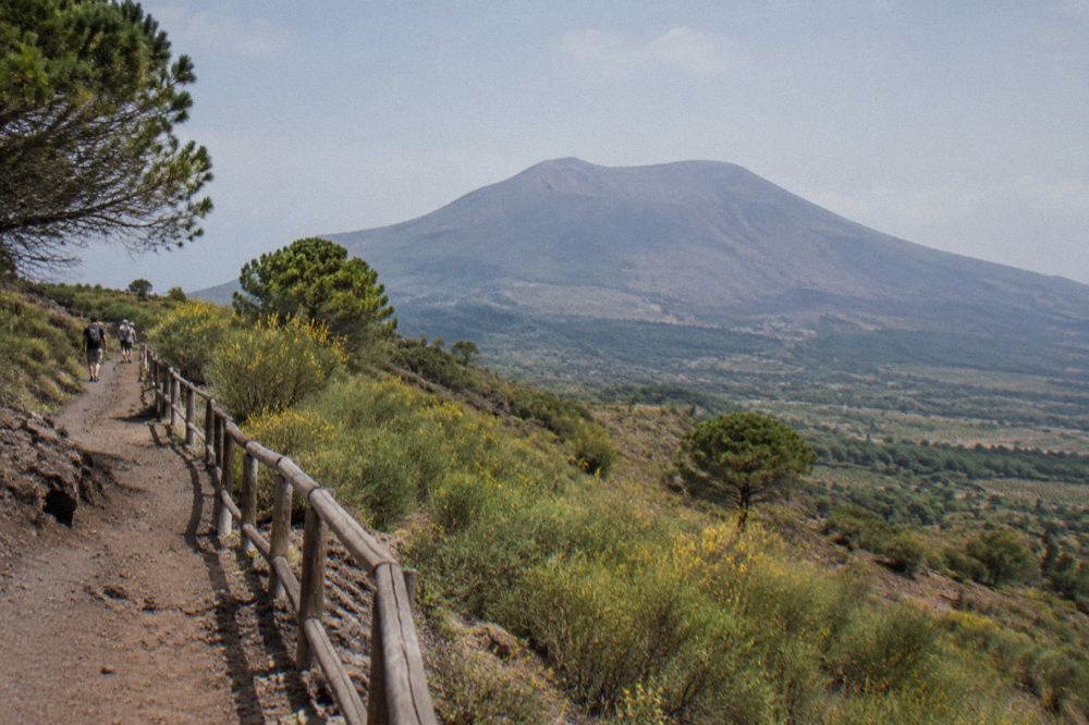 Volcanic gravel crater trail of Mount Vesuvius with the Bay of Naples visible below