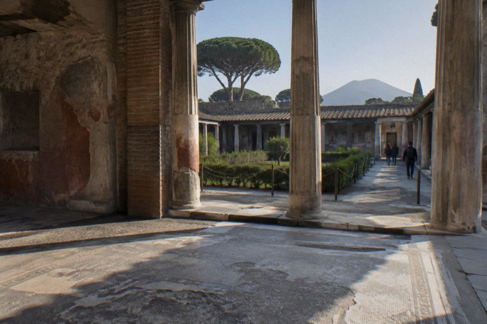 Row of broken columns and stone ruins inside the Pompeii archaeological park