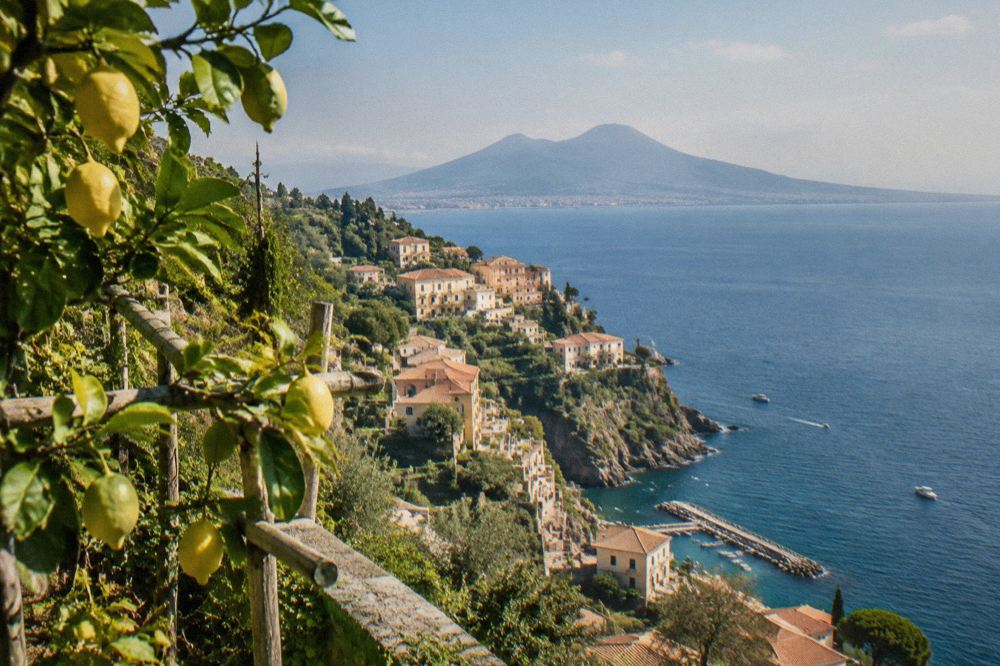 A harbour on the Sorrento peninsula with ferry boats moored along the quay at morning