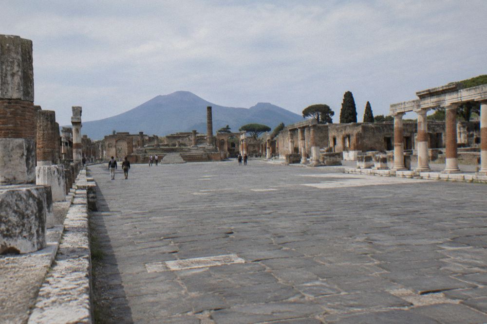 Worn basalt paving stones and high stepping stones on an ancient Pompeii street