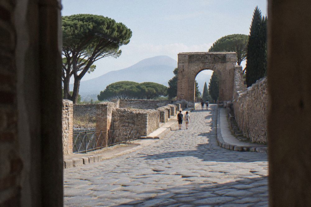 Ancient stone street of a Roman town with worn paving stones and ruined walls