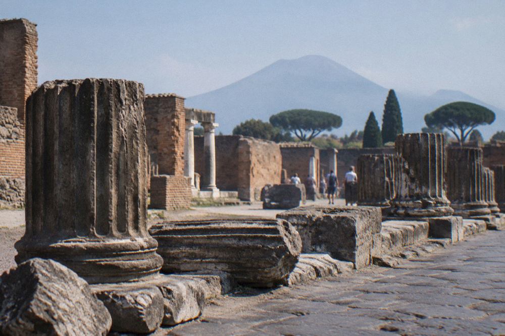 Faded ancient Latin wall inscriptions on a plastered wall in Pompeii