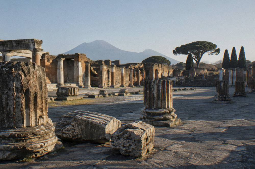 A close view of weathered painted letters on an ancient plastered wall in Pompeii