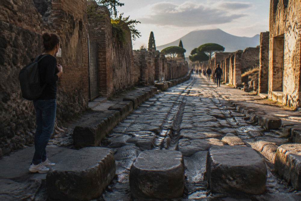 A watchdog mosaic on the floor at the entrance of an excavated Roman house in Pompeii