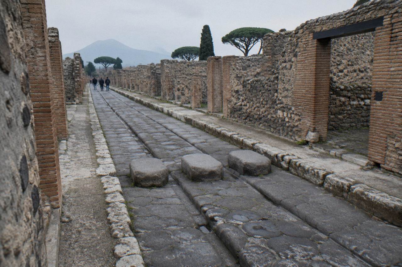 A watchdog mosaic on the floor at the entrance of an excavated Roman house in Pompeii