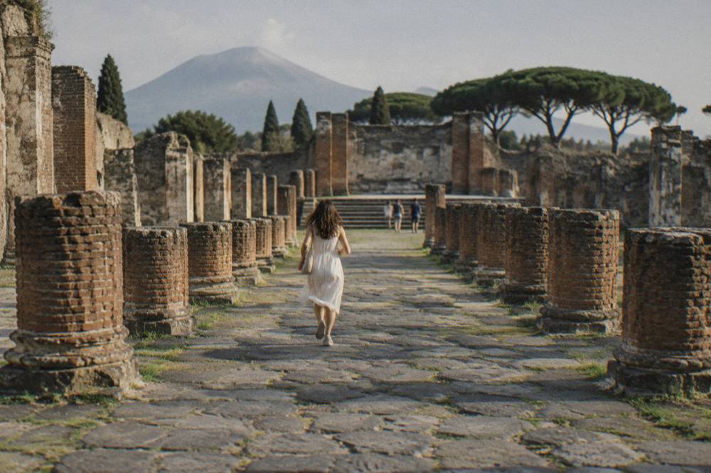 Uneven ancient stone paving underfoot on a street in Pompeii