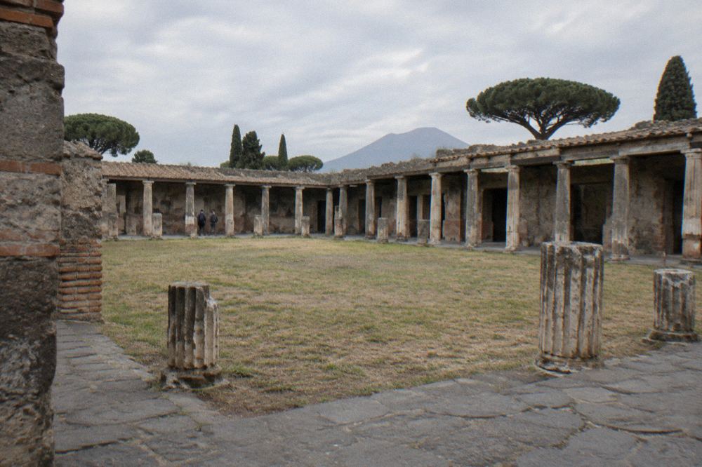 Ancient stone street with raised stepping stones and worn paving in Pompeii