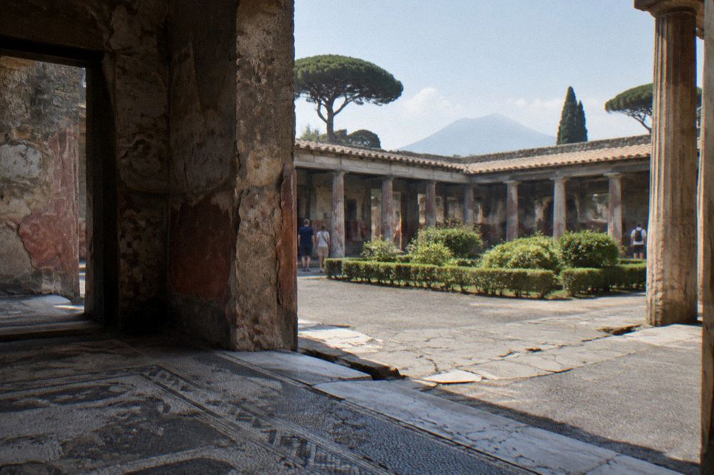Fragments of painted plaster wall surviving on an ancient structure in Pompeii