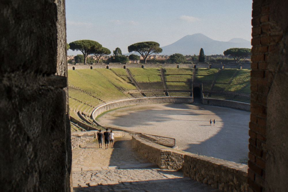 Close view of a single stone arch of the Herculaneum boat sheds with worn brick vaulting