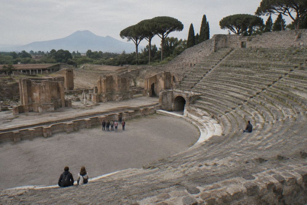 Stone millworks of an ancient Roman bakery inside a ruined house in Pompeii