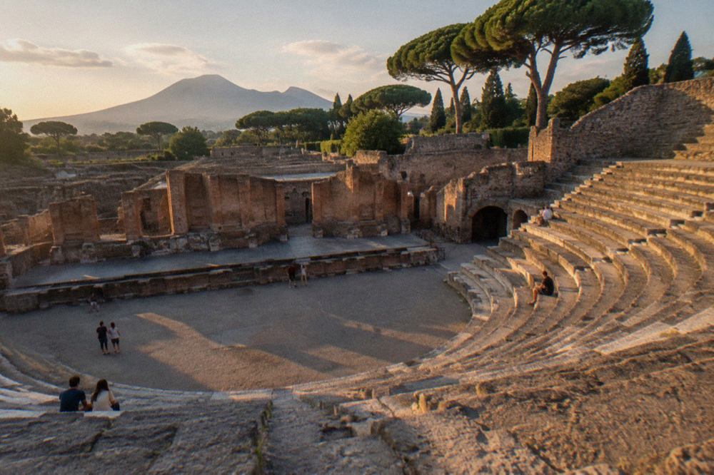 The tiered stone seating of an ancient Roman theatre under an open sky