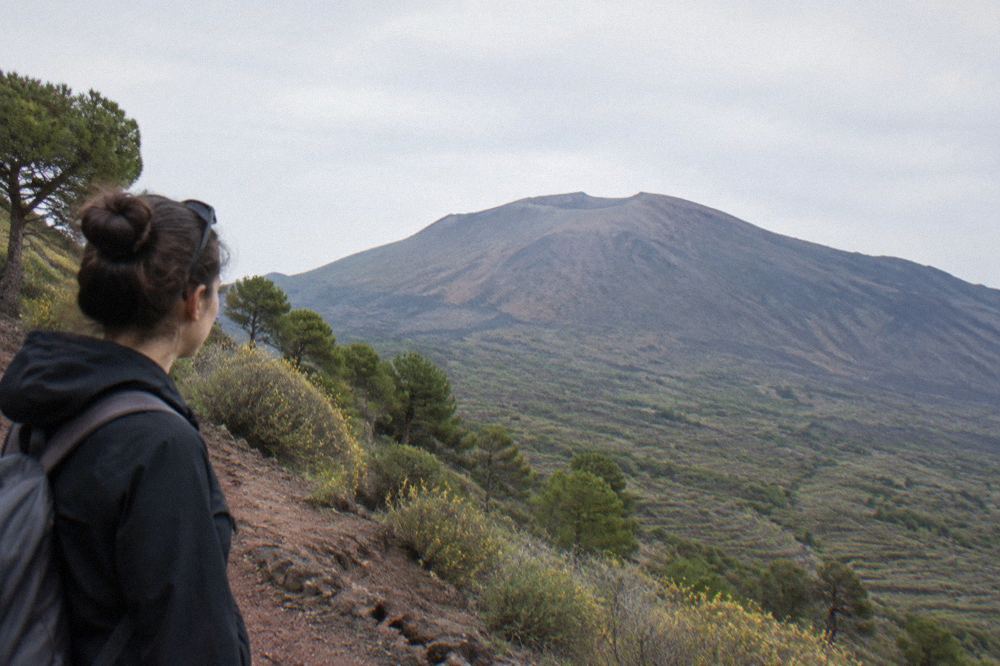 A stone trail winding up the ash slope toward the Vesuvius crater rim