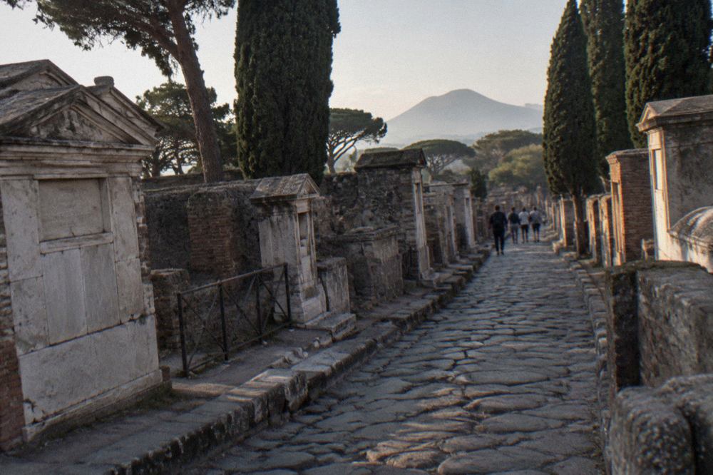 Row of ancient Roman tombs along a stone street outside the city walls of Pompeii
