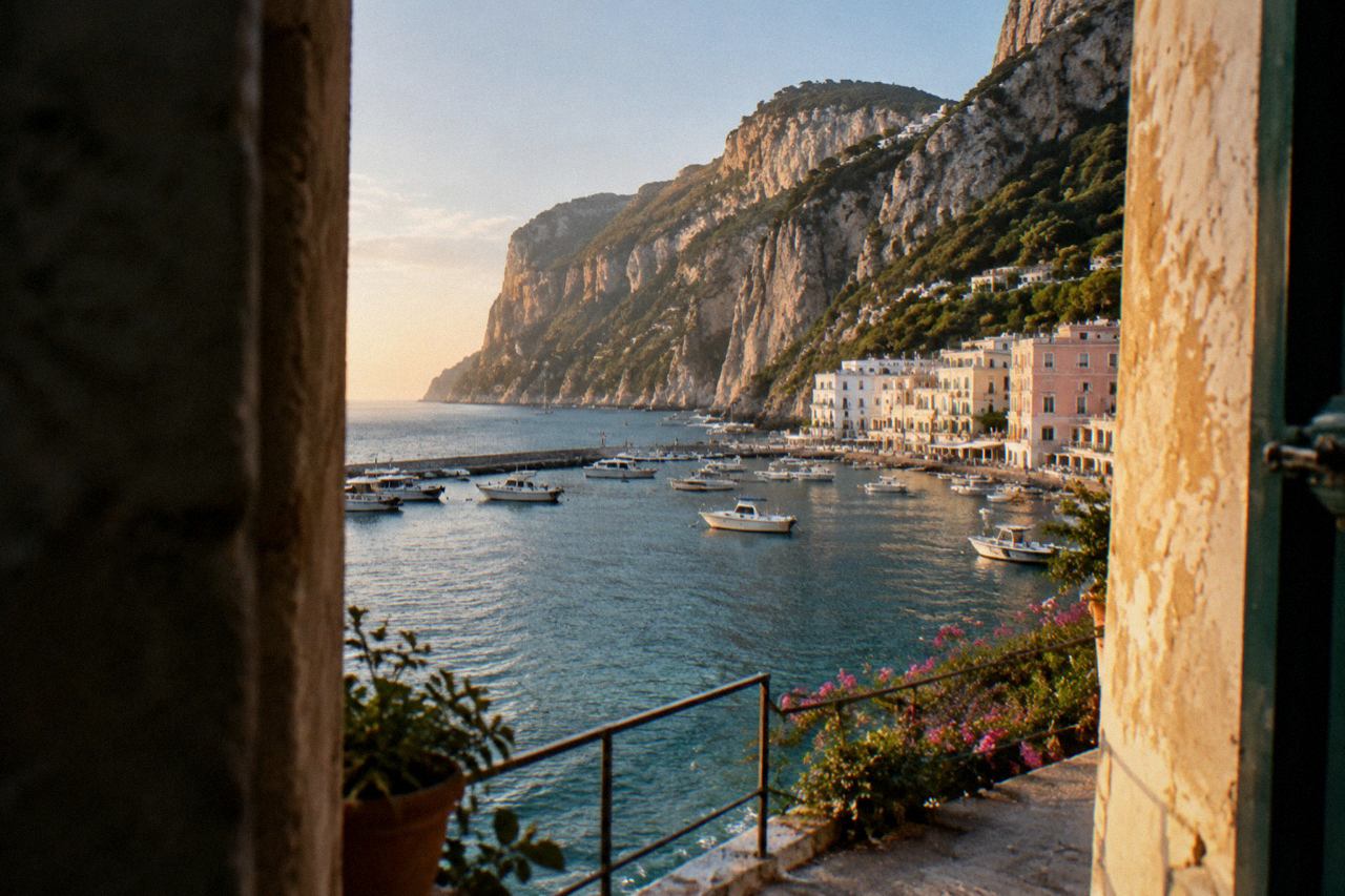 Cliffside houses above a small marina on an island in the Bay of Naples