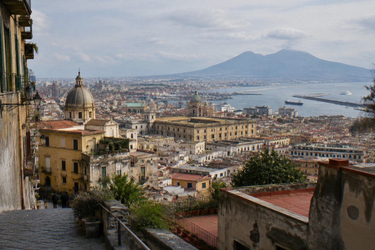 The excavated Roman street of Pompeii with Mount Vesuvius rising in the background