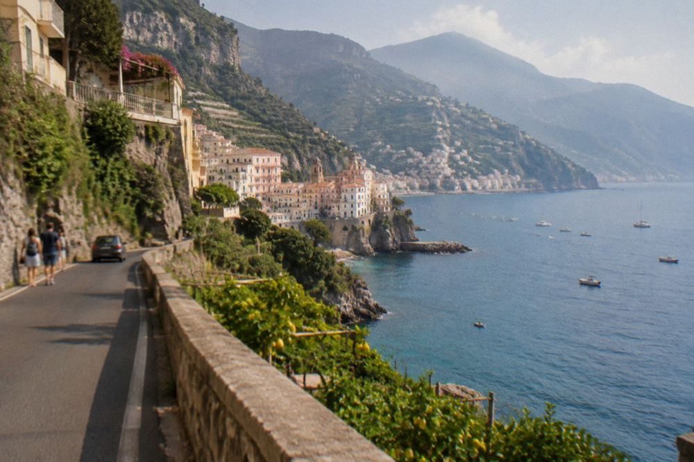 Winding cliff road above the sea with dry stone terraces and lemon groves