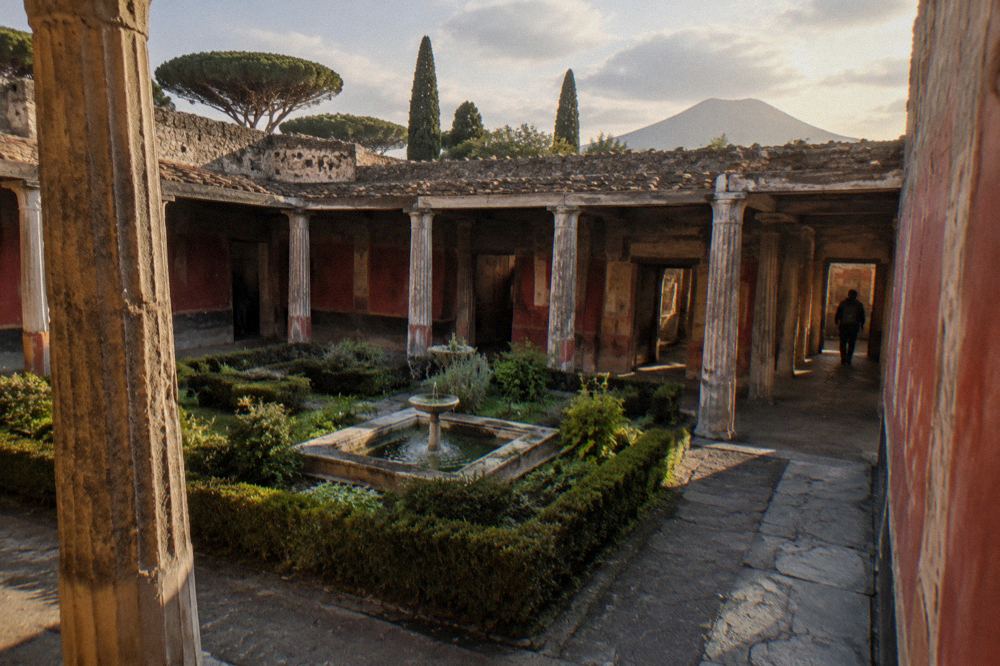 Basilica ruins of Pompeii with tall brick columns standing open to the sky