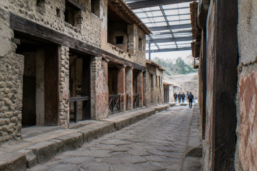 Modern residential buildings of Ercolano on a hillside with the profile of Vesuvius above the rooftops