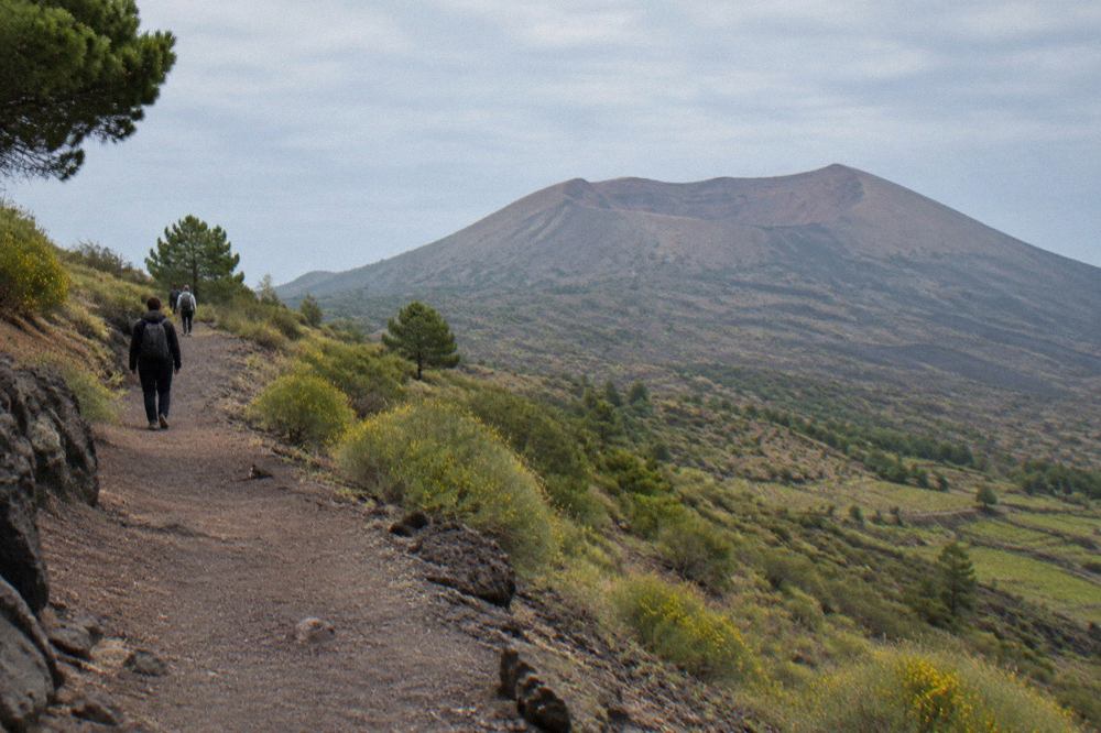 The crater rim of Mount Vesuvius under a clear sky above the Bay of Naples