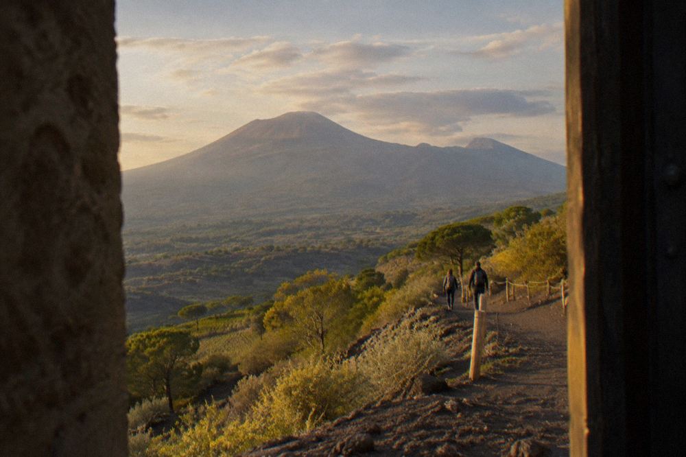 A gravel path winding up the western slope of Vesuvius toward the crater rim