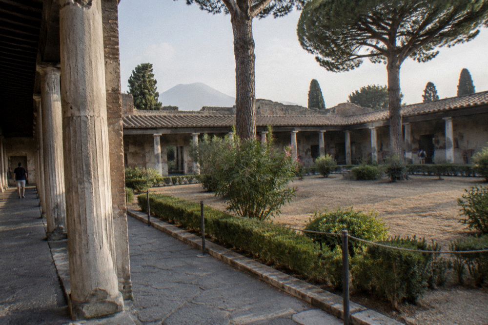 The excavated ruins of Pompeii seen from the slopes of Vesuvius with rows of ancient walls