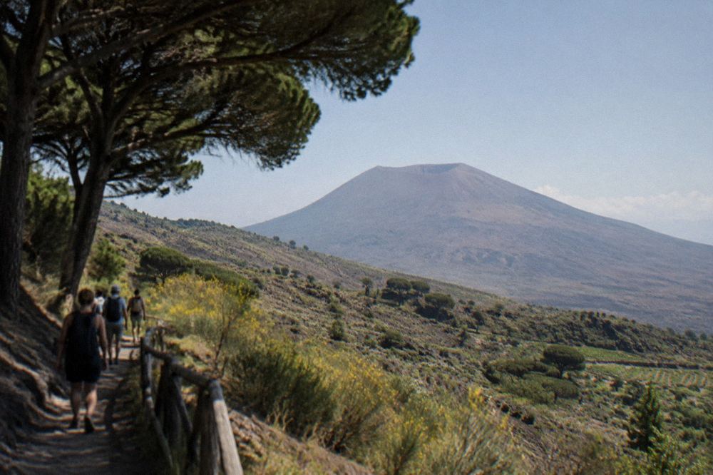 The bare ash-and-rock upper slopes of Vesuvius with the crater depression beyond