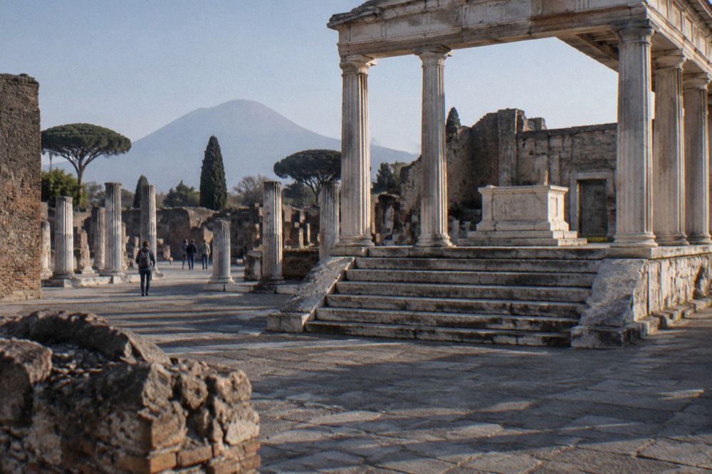 The entrance gate of the Vesuvius Gran Cono trail with visitors queuing at the checkpoint
