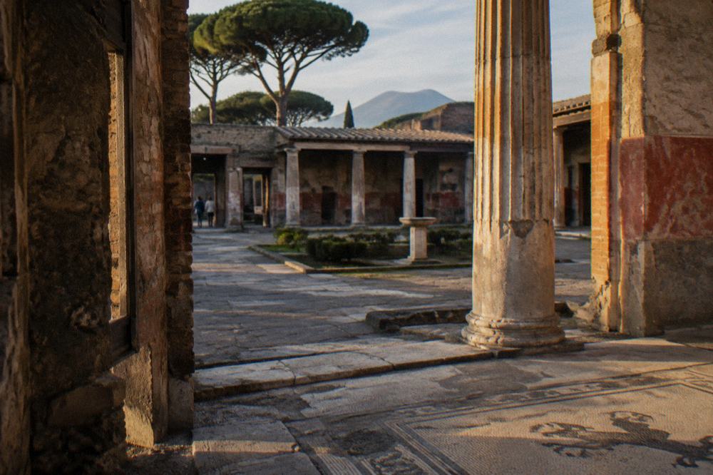Ancient stone stepping stones crossing a rutted Roman street in Pompeii