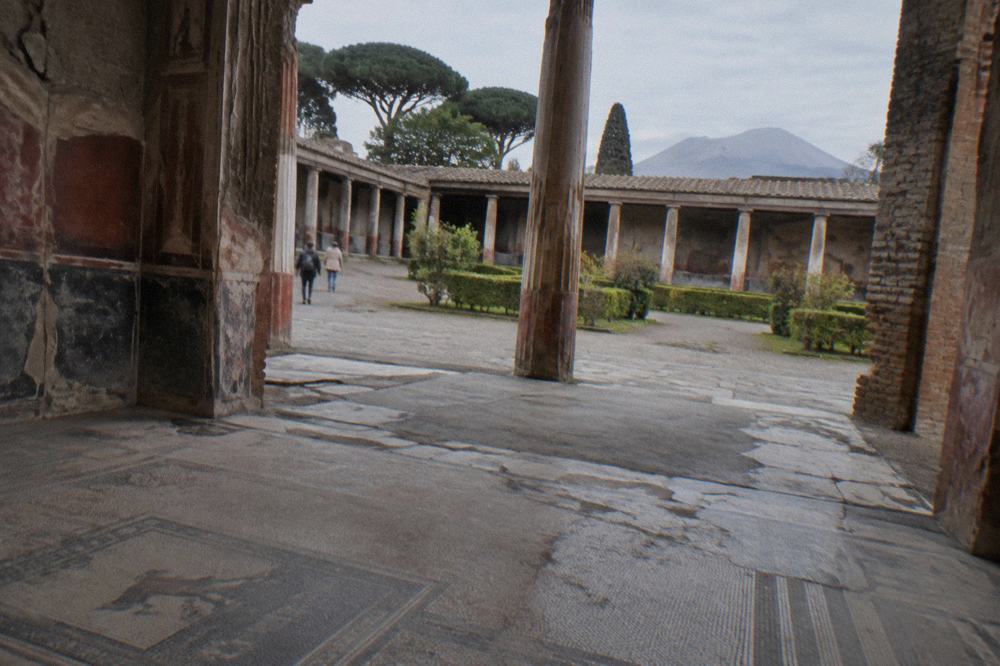 Row of stone columns bordering an open paved square in the ancient city