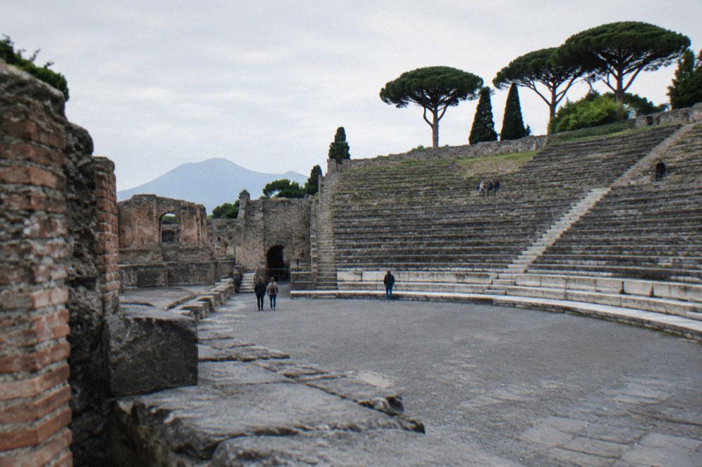 A sunlit painted wall and garden area of a Roman house at Pompeii