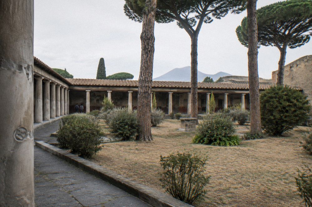 Regional train stopped at a small station platform near Pompei