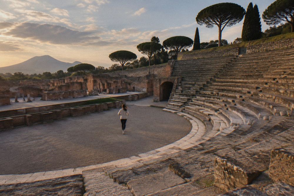 Stone gate of an ancient Pompeii entrance with worn stepping stones