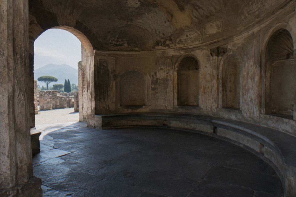 Ticket office area near an ancient gateway at the edge of the Pompeii park