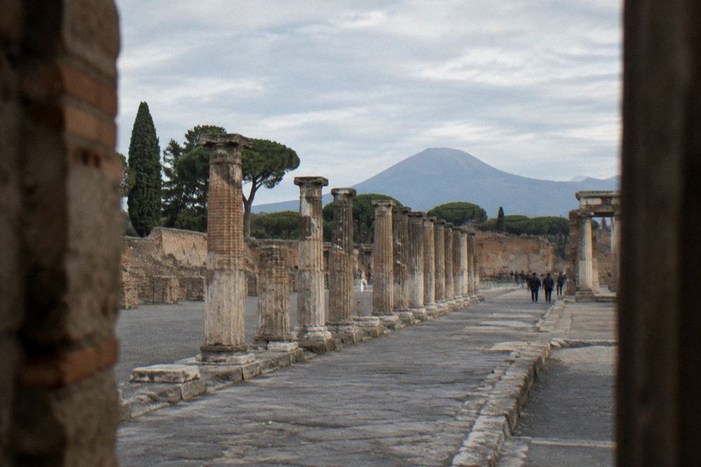 Regional train at a small station platform near the Pompeii excavations