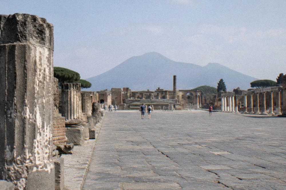Stone gate opening at an entrance to the ancient city of Pompeii