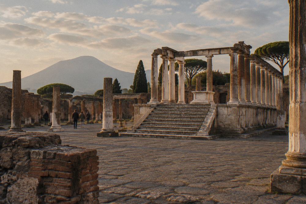 Stone gateway of an entrance to Pompeii with the ancient walls in afternoon light