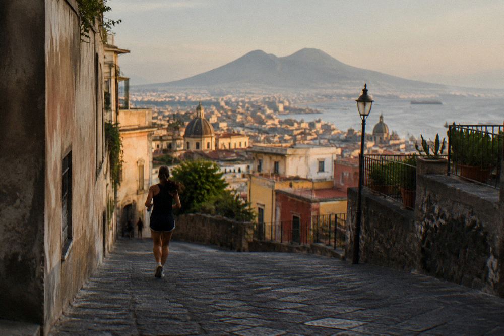 The rim of the Vesuvius crater with sulphur-streaked rock and the Bay of Naples beyond