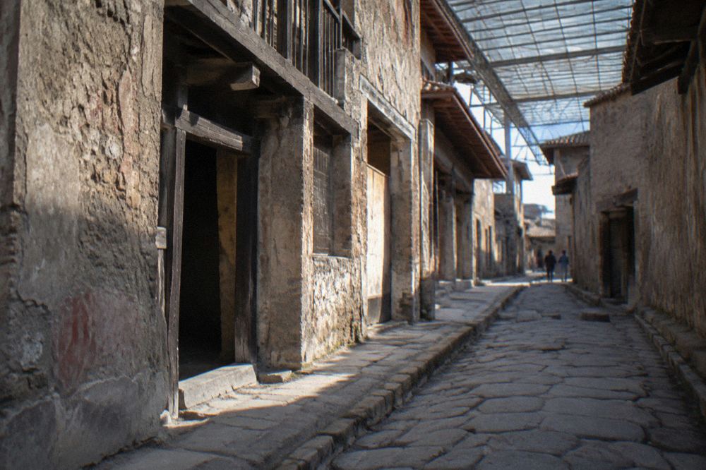 Frescoed wall with red panels inside a preserved Roman house