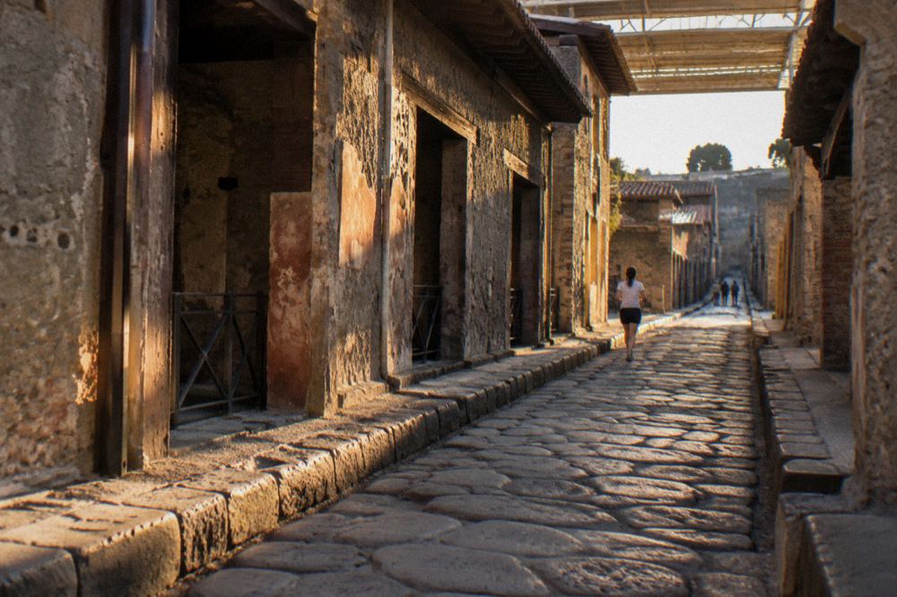 Regional train at a small station platform near Bay of Naples archaeological sites