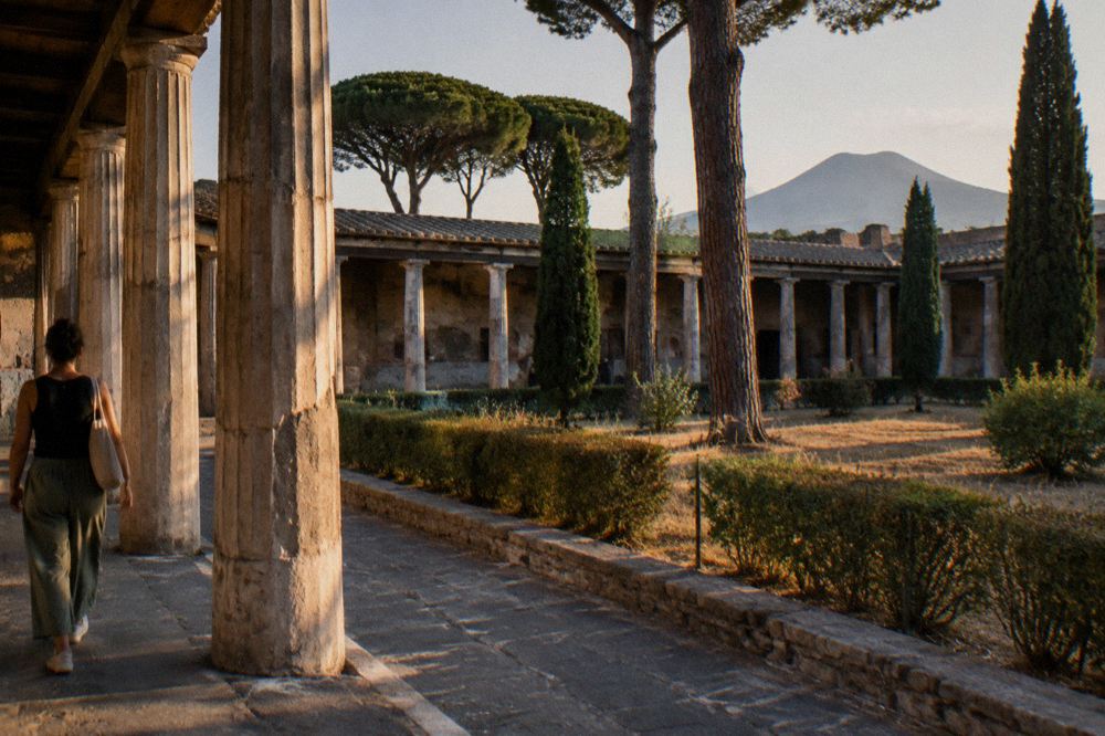 Wide ancient plaza with column stumps under a clear sky