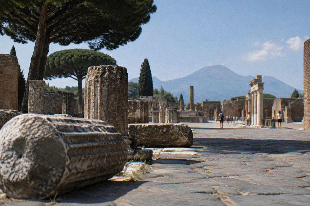 Grass-covered amphitheatre arena at Pompeii seen from the upper seating rows