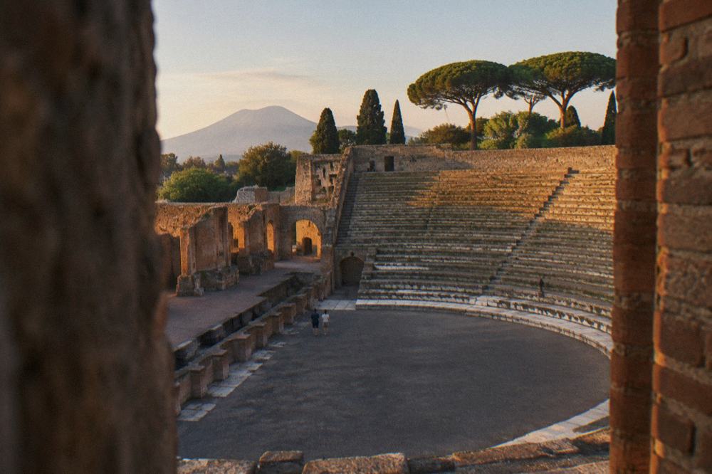 Marble-floored Roman bath hall at Pompeii with arched ceiling niches for bathers
