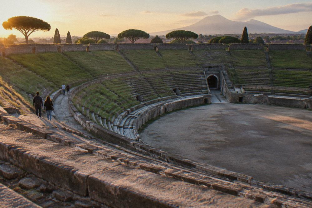 Ancient stone street in Pompeii with worn cart ruts and ruined walls under a clear sky